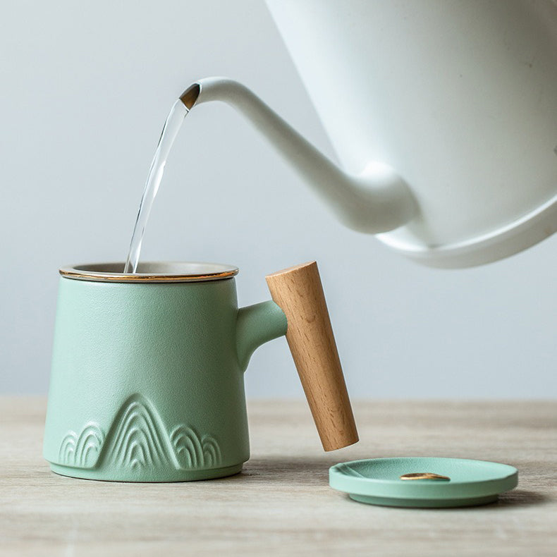 Close-up of traditional Japanese ceramic tea cup with wooden handle