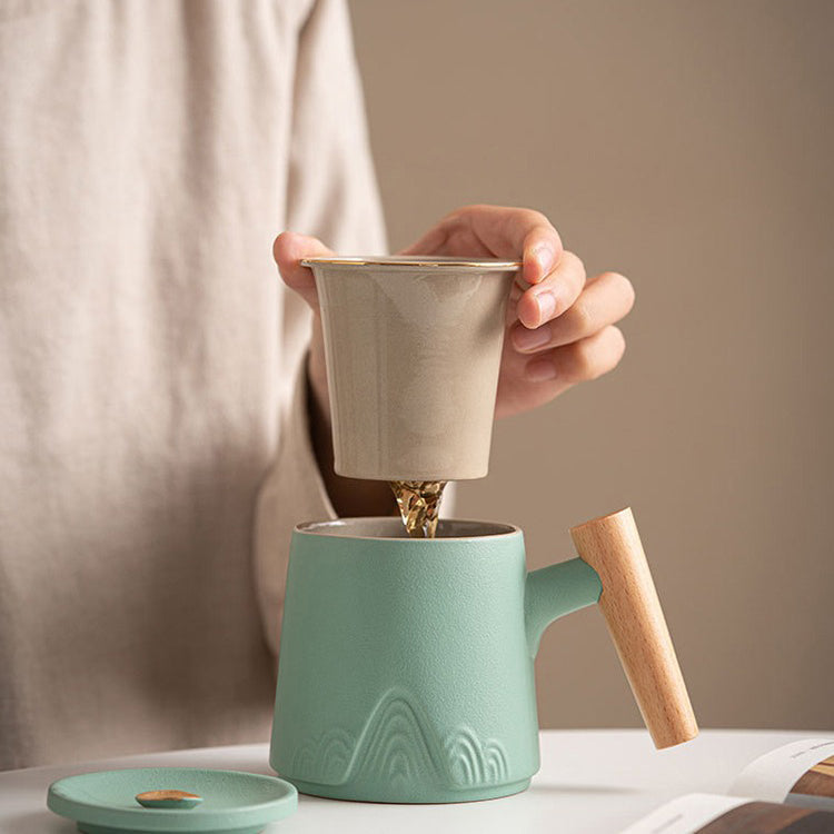 Japanese tea being poured into ceramic cup with wooden handle for a refined tea experience