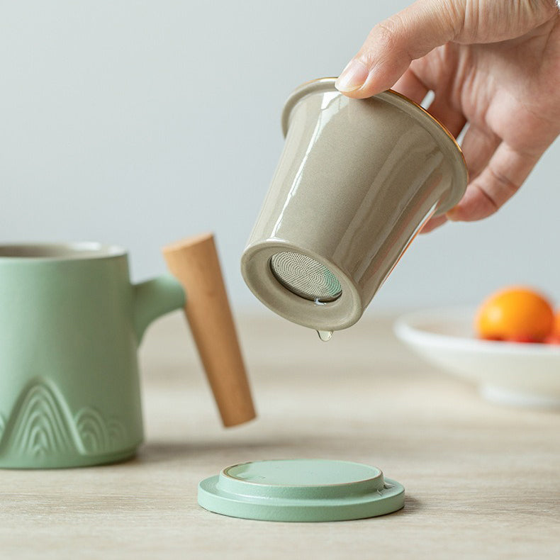 Close-up of traditional Japanese ceramic tea cup with wooden handle