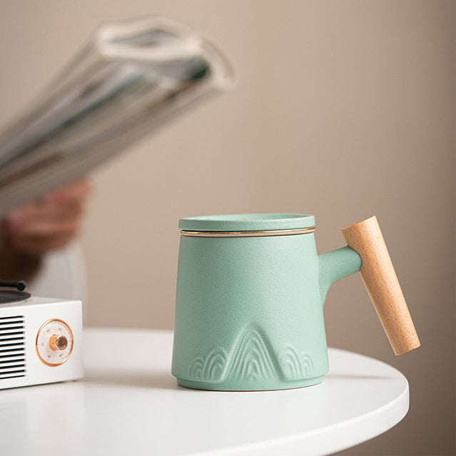 Japanese tea being poured into ceramic cup with wooden handle for a refined tea experience