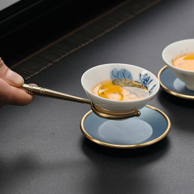 Close-up of colorful copper tea tools for Gong fu tea ceremony