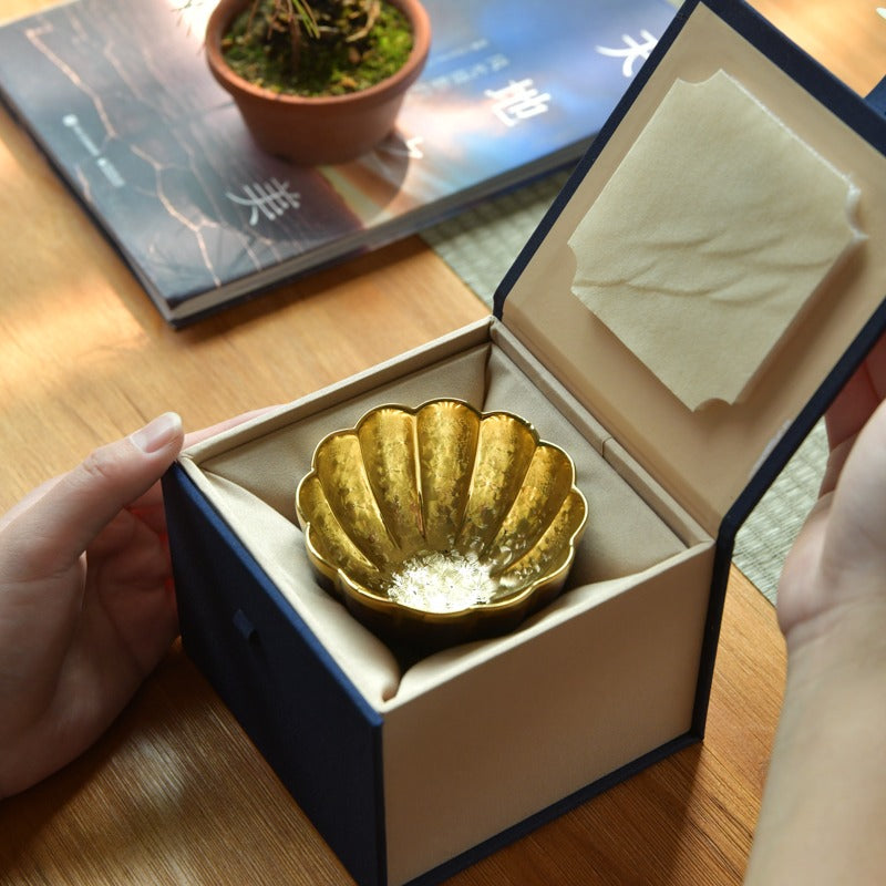Lifestyle image of the Jian Zhan tea cups in use during a traditional Chinese tea ceremony.