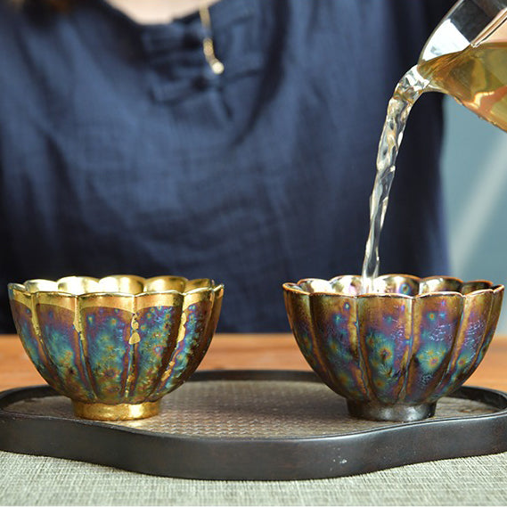 Lifestyle image of the Jian Zhan tea cups in use during a traditional Chinese tea ceremony.