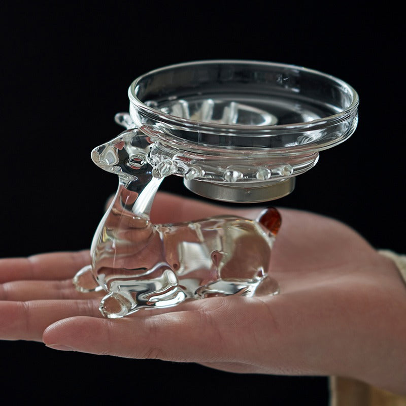 Close-up of the deer holder feature of the glass tea strainer, emphasizing its unique aesthetic.