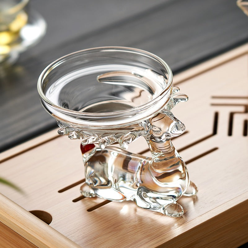 Close-up of the deer holder feature of the glass tea strainer, emphasizing its unique aesthetic.