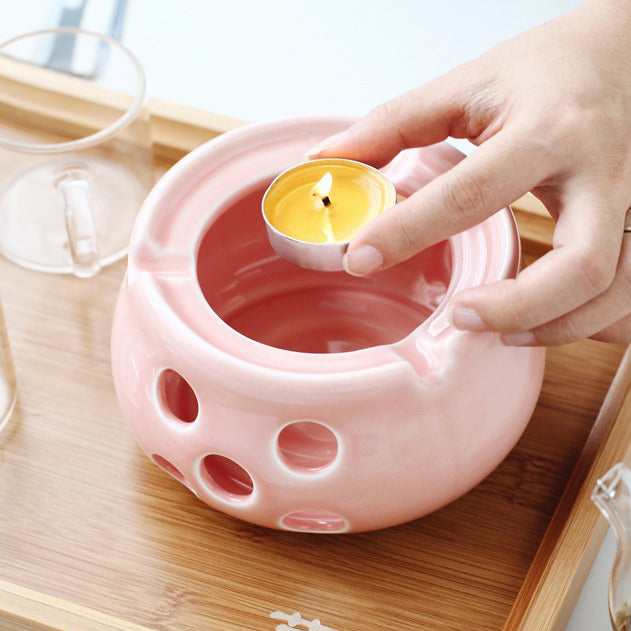 Stylish glass tea set with warmer, ideal for gifting or personal use