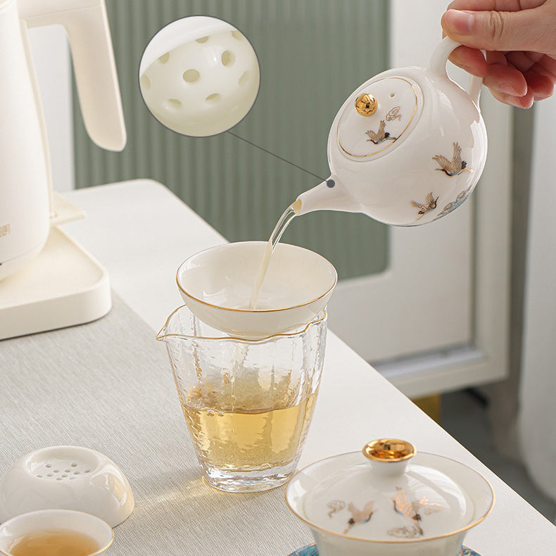 Close-up of the intricate crane design on the ceramic tea set