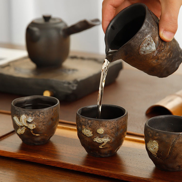 Close-up of the gold lotus seed kyusu tea pot with carved lotus design