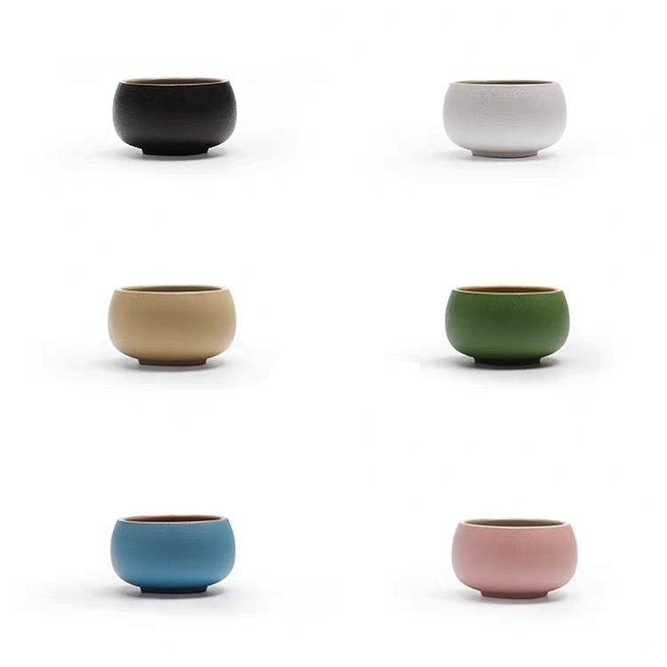 Elegant set of six ceramic teacups in various colors, ideal for tea enjoyment