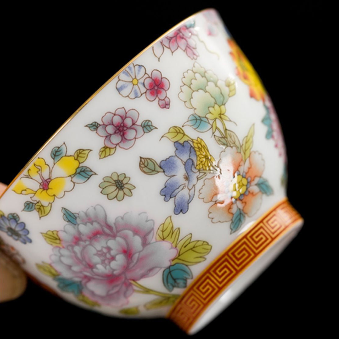 Elegant six-color enamel Kung Fu tea set on display with peony design.