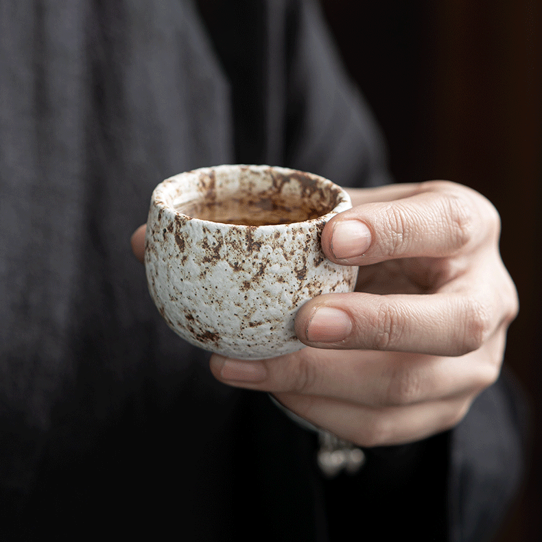 Artistic display of the Wabi-sabi tea cups, emphasizing their smooth texture and natural gold spots.
