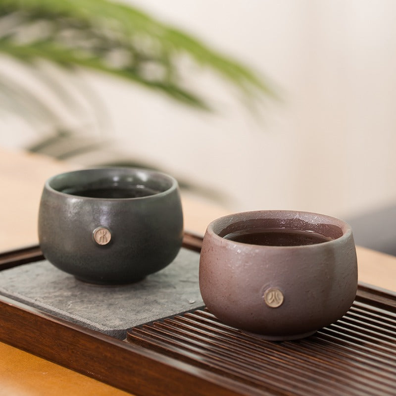 Side view of the best handmade ceramic tea cups arranged elegantly for display.