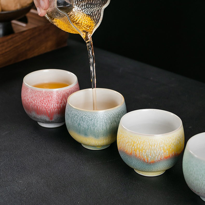 Close-up of unique handmade kung fu tea cups showcasing vibrant colors and textures.