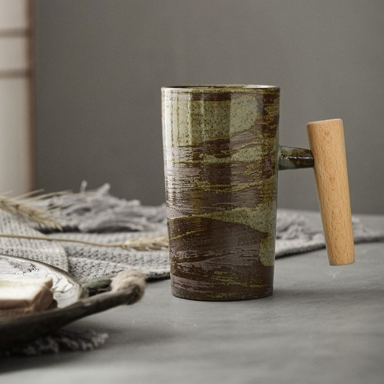 Lifestyle shot of the wooden handle mug on a rustic table, filled with coffee.