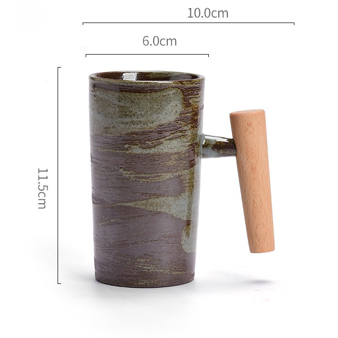 Lifestyle shot of the wooden handle mug on a rustic table, filled with coffee.