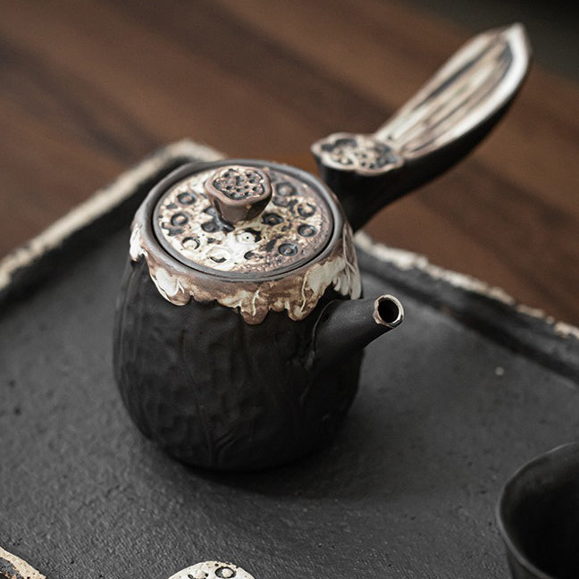 Elegant Wabi-Sabi Lotus Teapot with side handle, showcasing intricate craftsmanship from a top view.