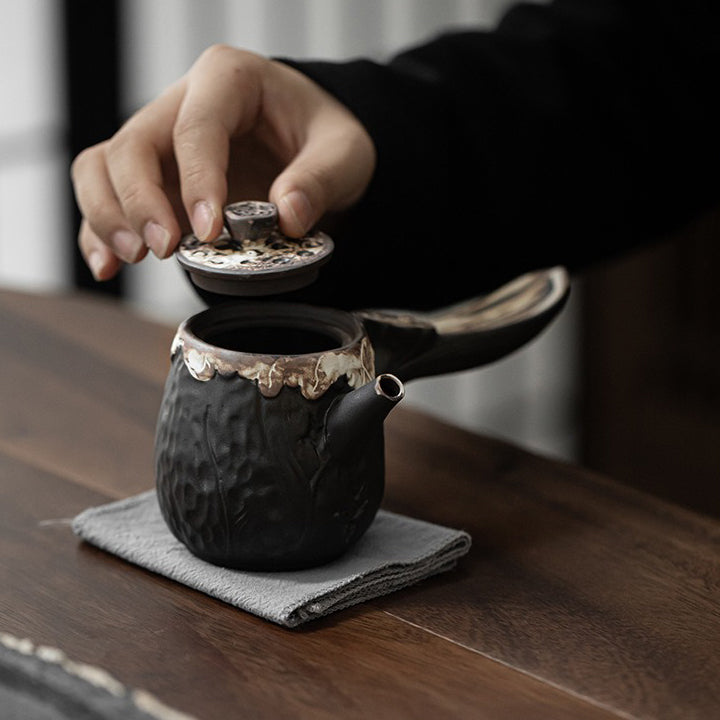 Close-up of the handcrafted texture on the Wabi-Sabi lotus teapot, highlighting its unique design.