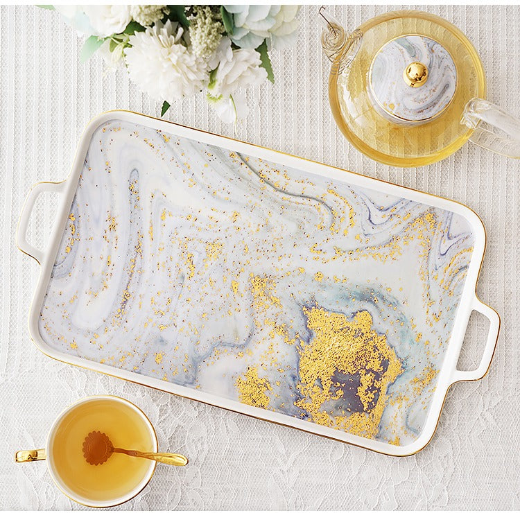 Ceramic teapot with gold splash design, ideal for afternoon tea gatherings