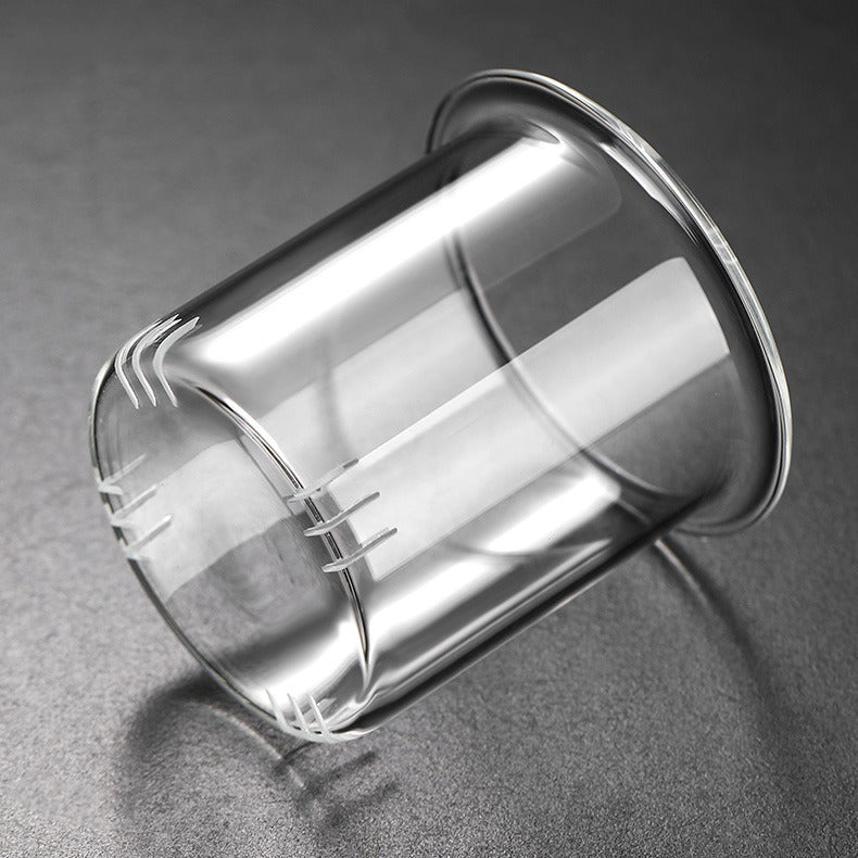 Close-up of borosilicate glass herbal tea pot with infuser, showcasing its heat-resistant qualities