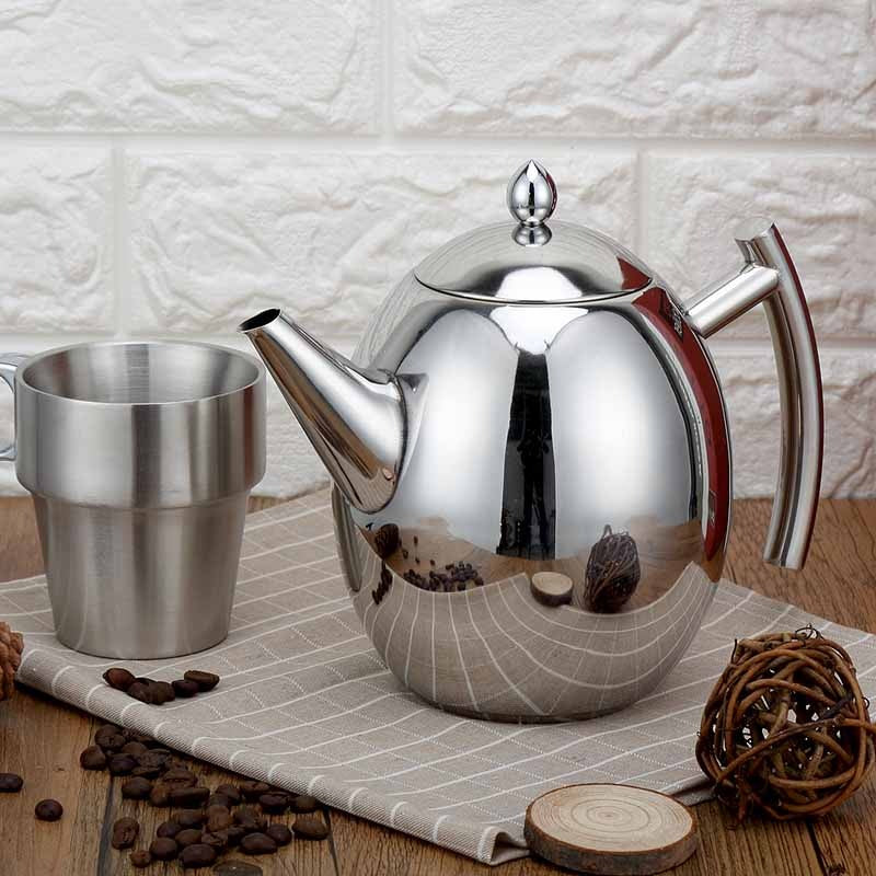 Elegant stainless steel teapot with removable infuser from an angle, showcasing the mirror finish.