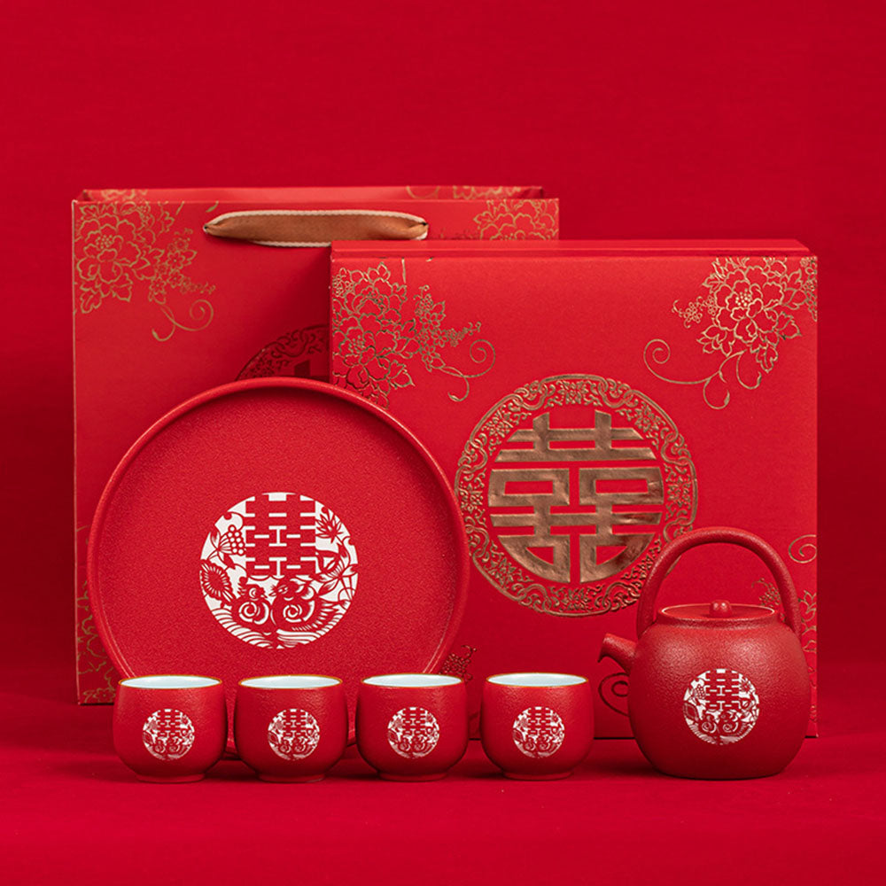 Double Happiness Red Wedding Tea Set displayed elegantly on a table, highlighting its intricate laser carvings.