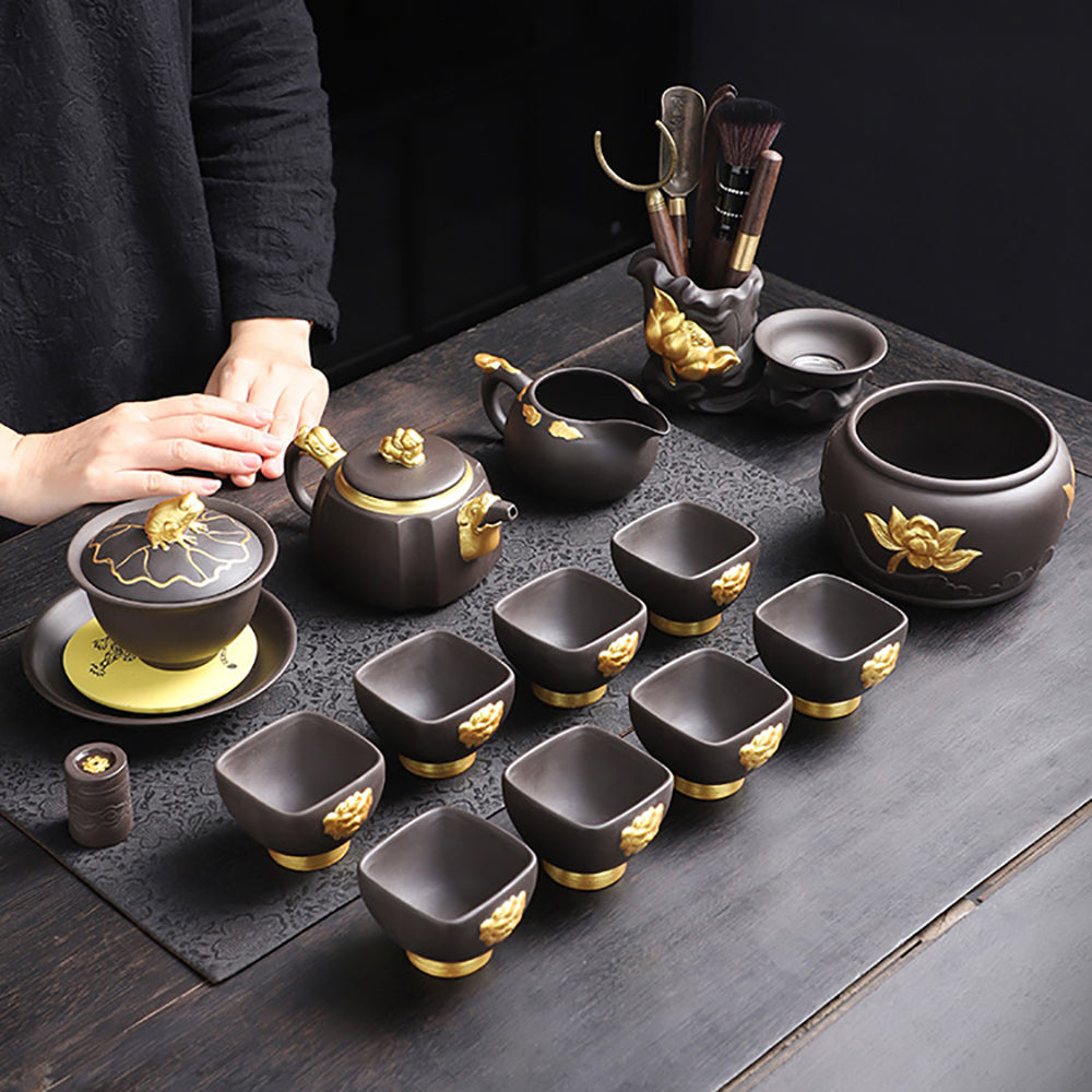 Front view of luxury purple clay tea set with gold dragon motif, showcasing intricate craftsmanship