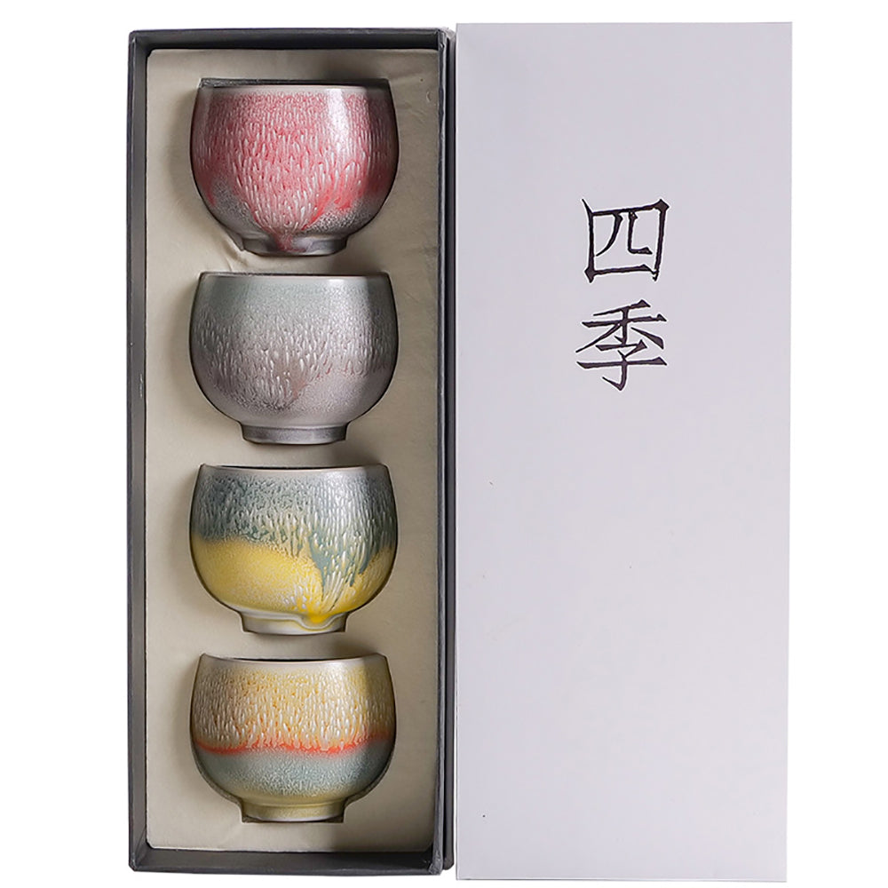 Close-up of unique handmade kung fu tea cups showcasing vibrant colors and textures.