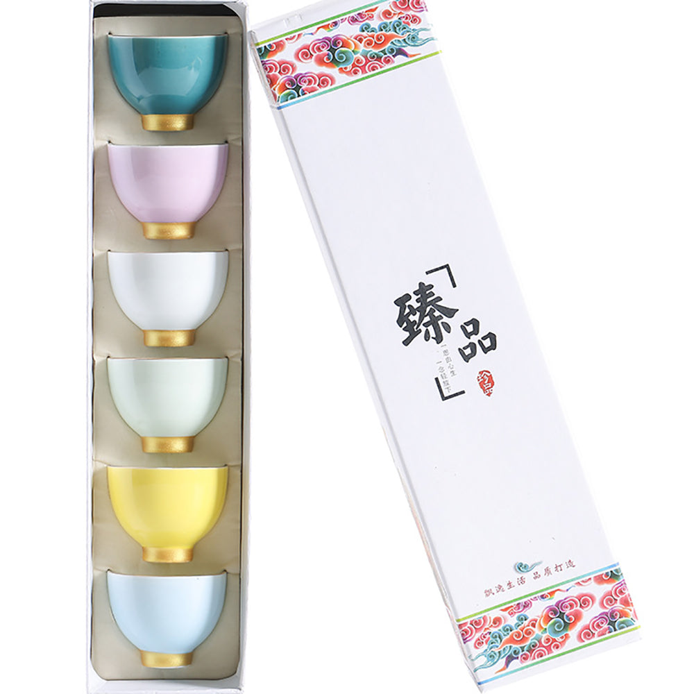 Elegant Morandi Kung Fu tea set showcasing six ceramic cups with gold accents from a side angle.