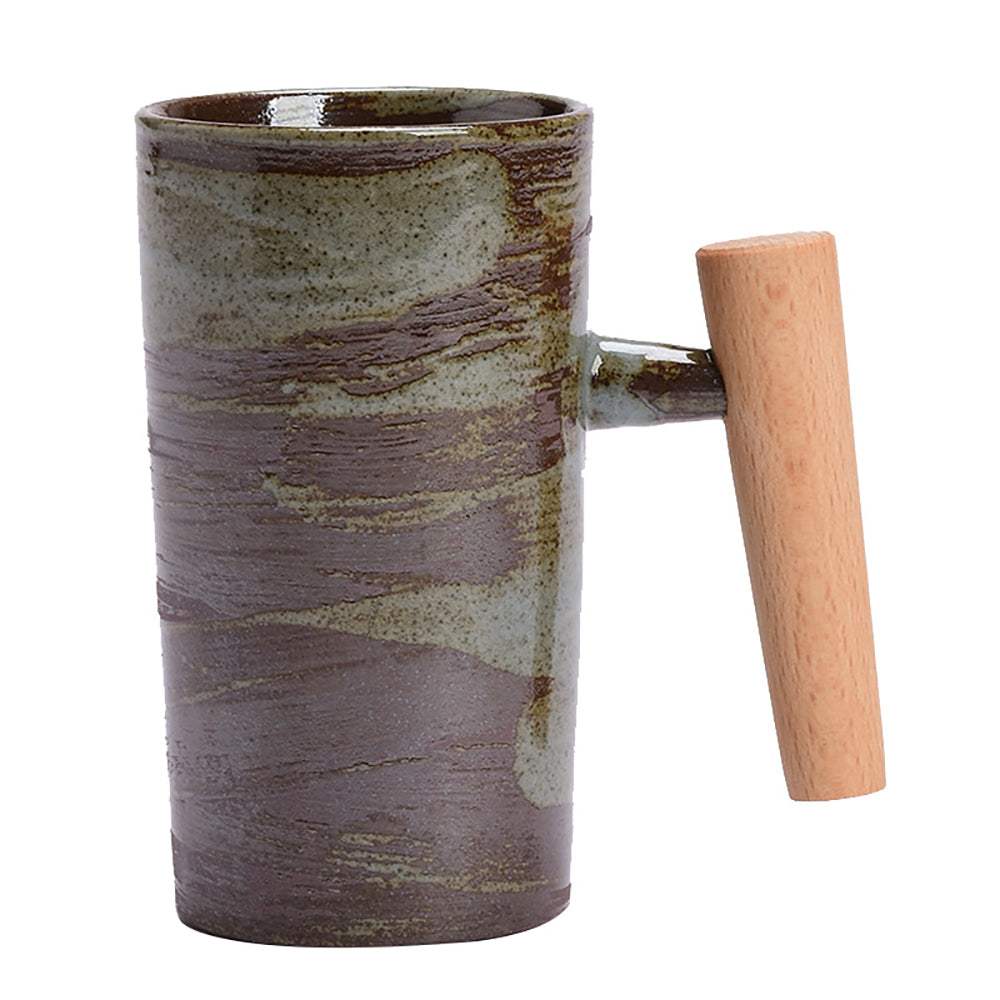 Close-up of the vintage Japanese ceramic mug showcasing its unique glaze and wooden handle.