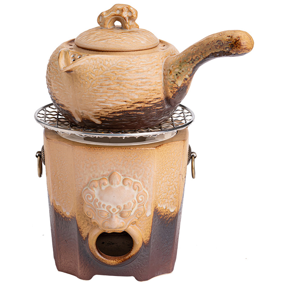 Traditional clay tea set featuring a heated teapot and charcoal stove, ideal for outdoor use.