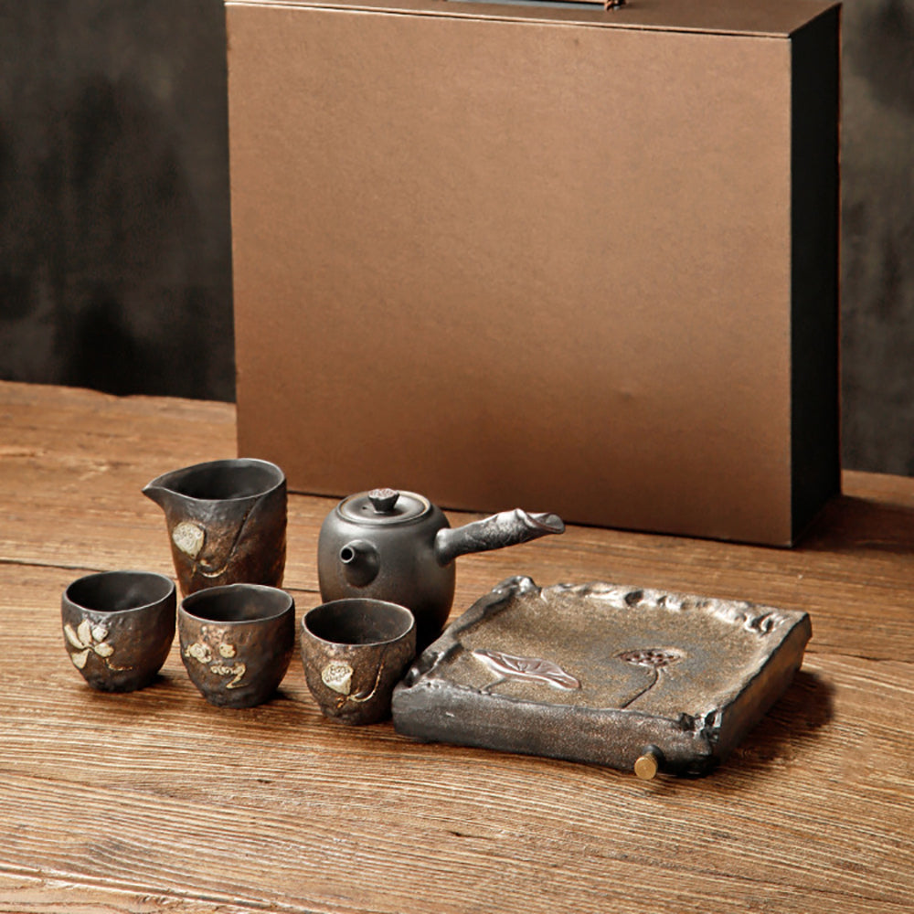 Close-up of the gold lotus seed kyusu tea pot with carved lotus design