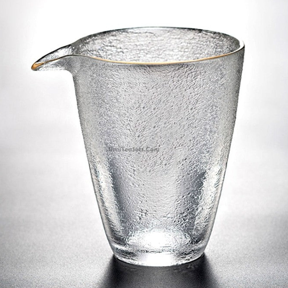 Overhead view of large tea mug with gold trim filled with jasmine tea