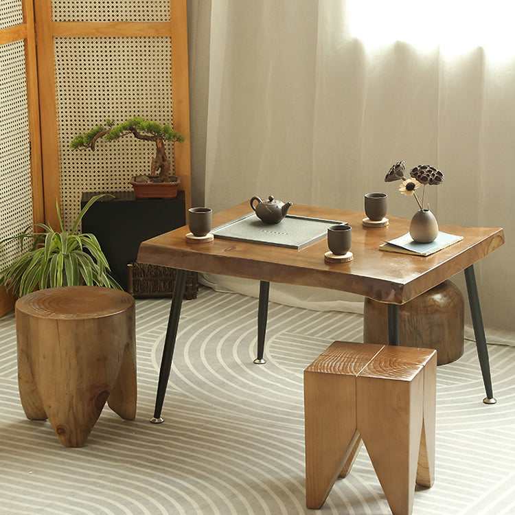 Close-up of a minimalist natural wood tea table with chairs, highlighting the smooth finish and simple design.