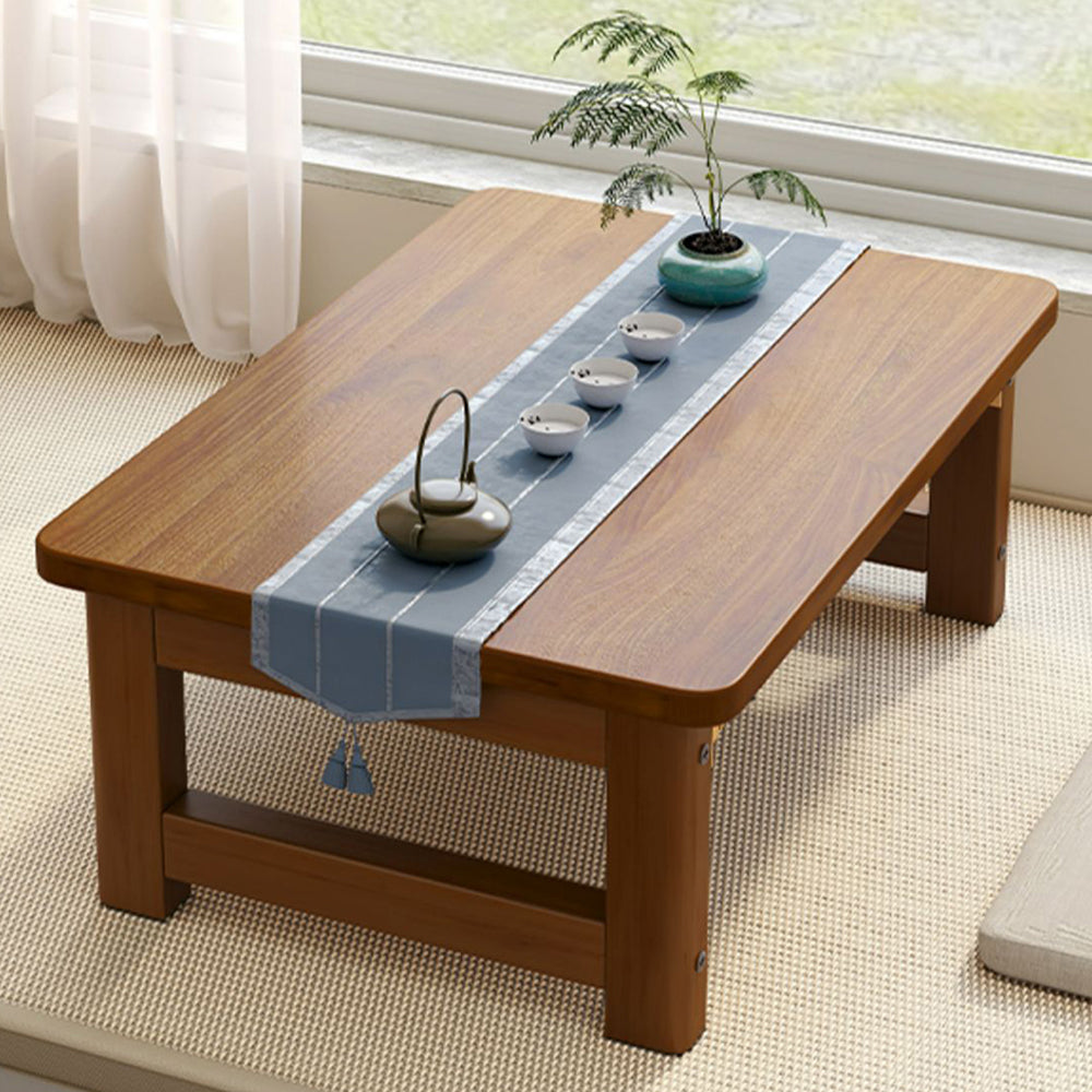 Close-up of the Japanese foldable solid wood tea table showing its smooth surface and foldable feature