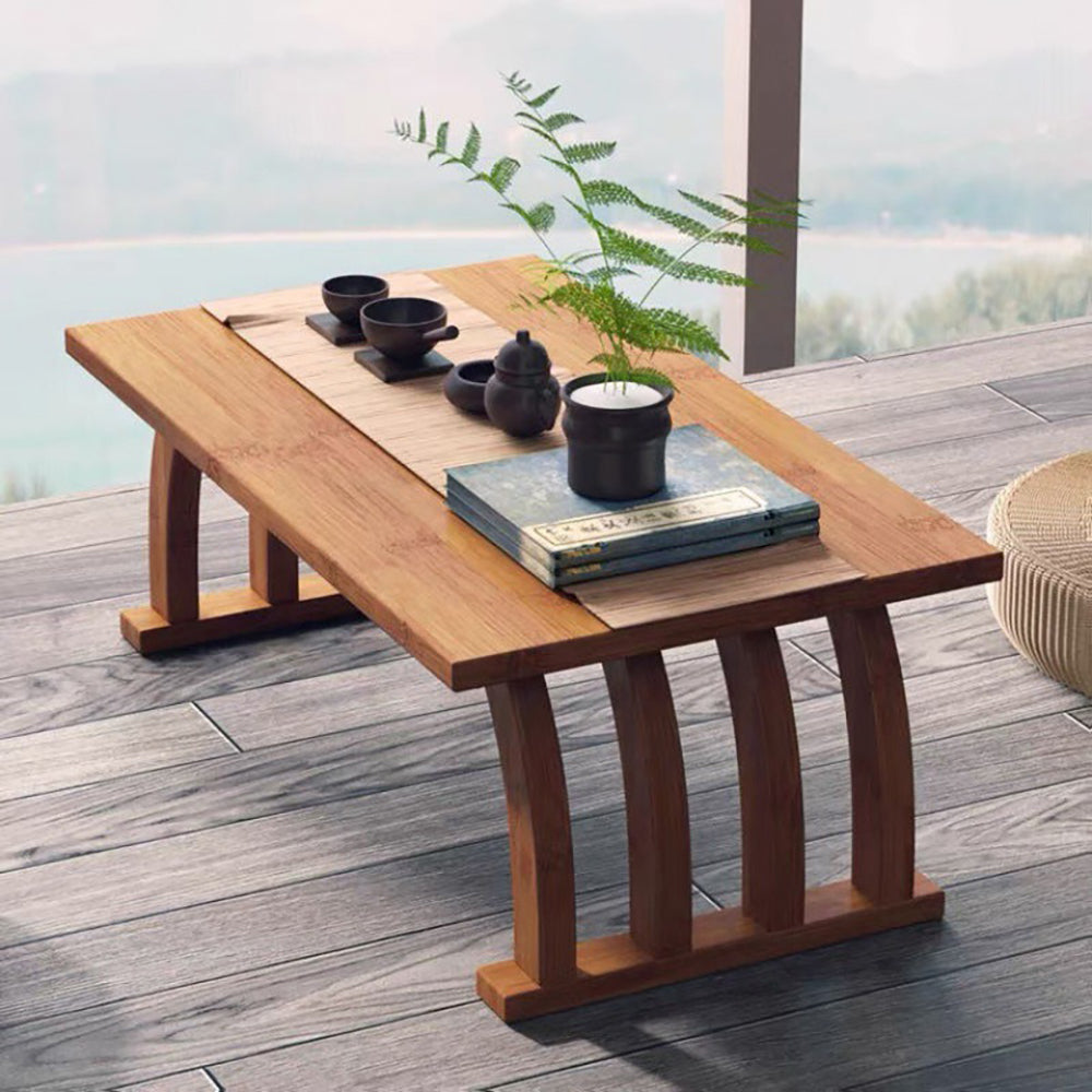 Bamboo arched tea table showcasing its elegant curves and structure in a modern living room setup.