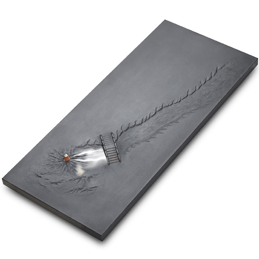 Elegant black stone tea tray showcasing its intricate grooves and design.