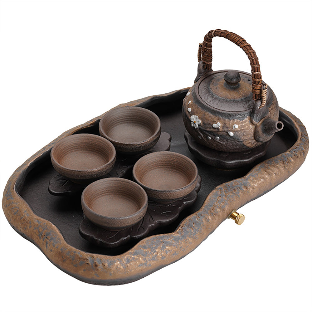 Lotus lake tea set displayed on a wooden table, highlighting the rustic charm of ceramic pottery.