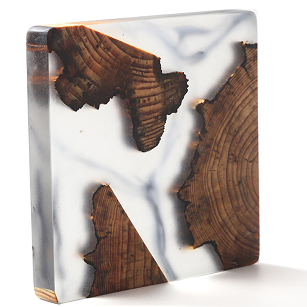 Close-up of epoxy coaster with tree design on wooden surface