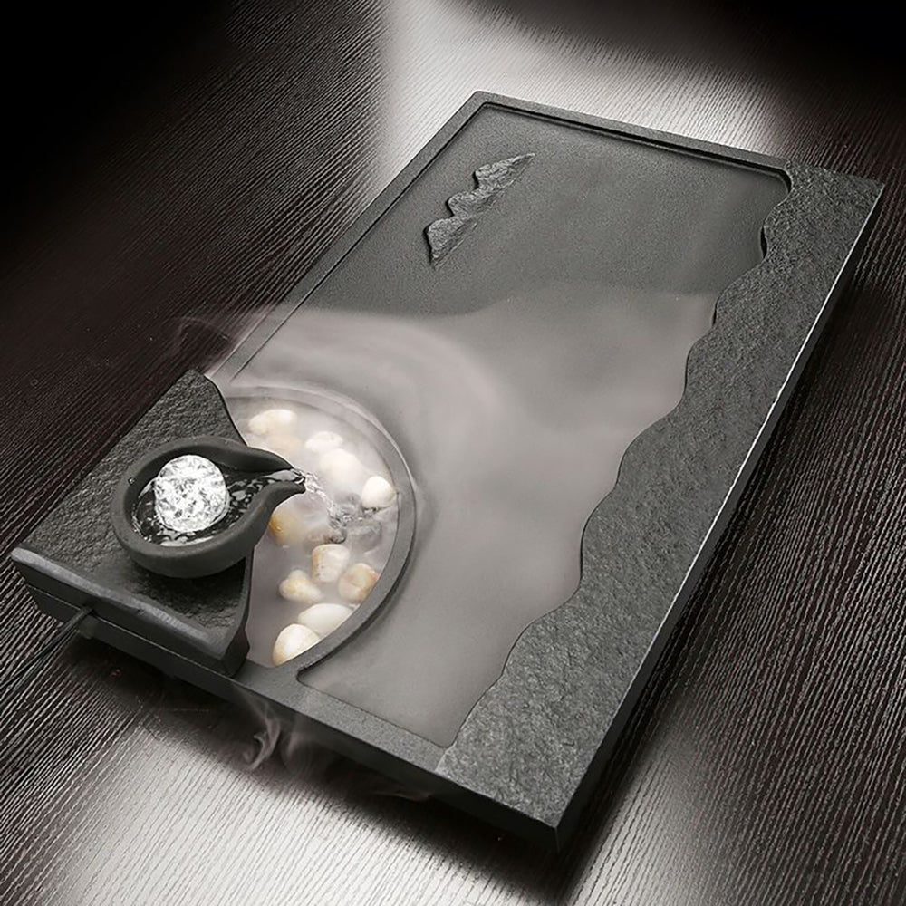 Top view of the flowing water tray with mist effect during a tea ceremony