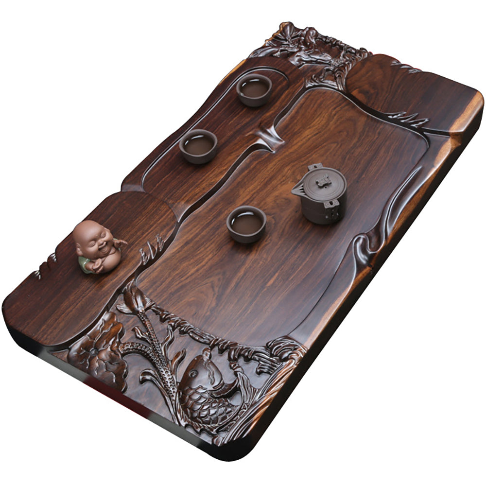 Top view of the wooden tray showcasing hand-carved goldfish and natural wood grain