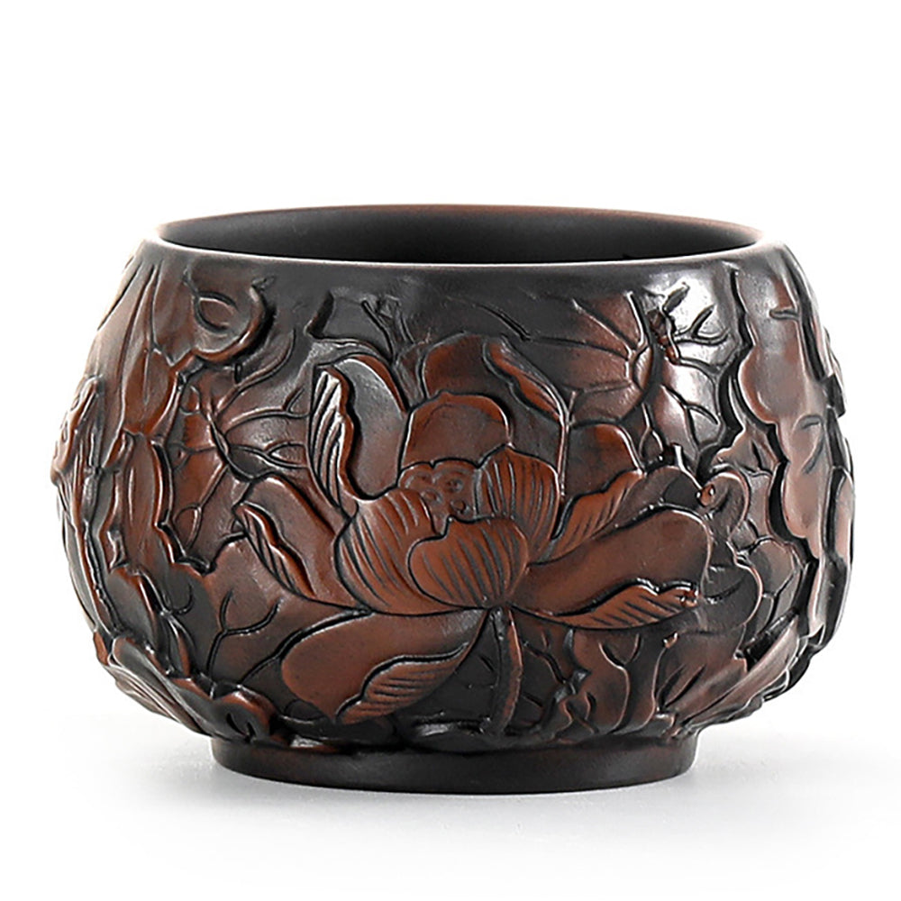 Close-up of the handcrafted lotus design on the Kung Fu tea cup, highlighting intricate details.
