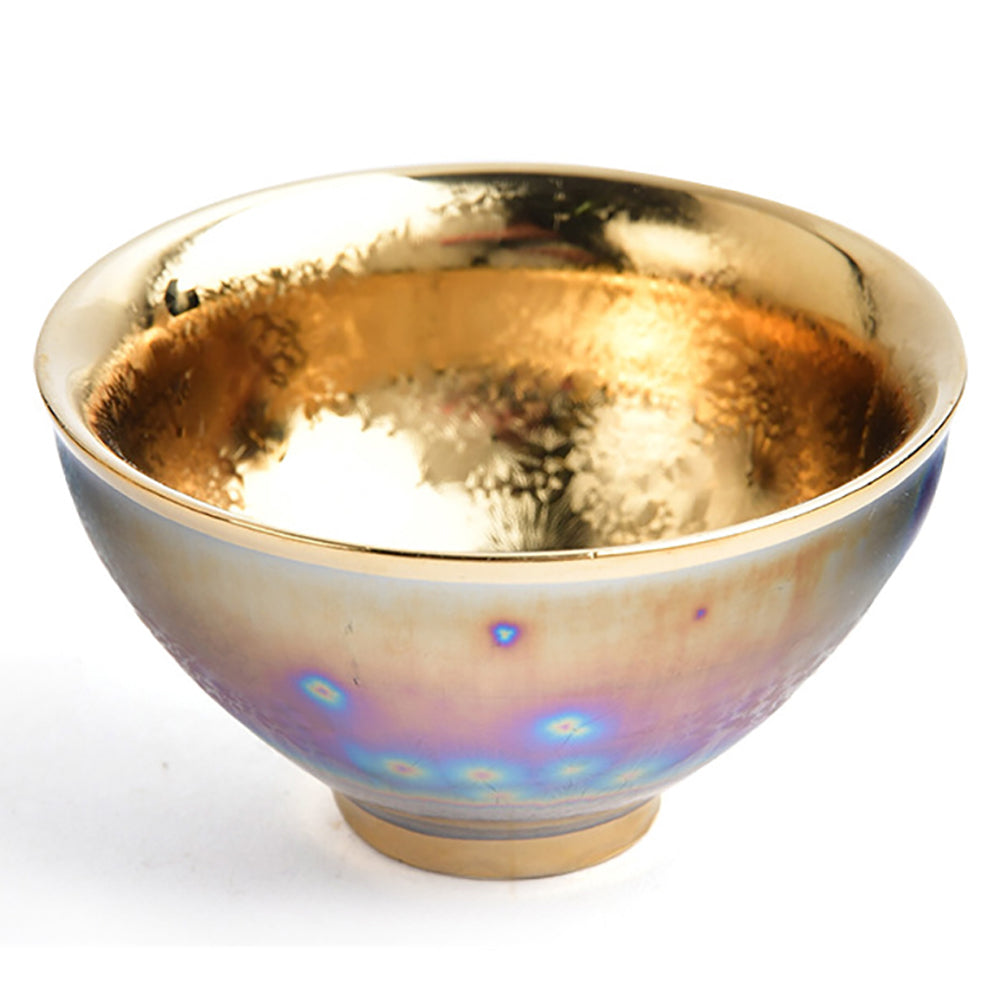 Elegant Gold Jianzhan Tea Cup showcasing its unique kiln variegated design from a side angle.