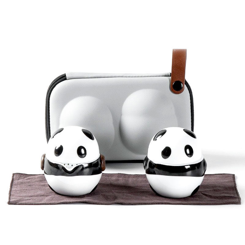 Panda portable tea set displayed with teapot and cups for travel.