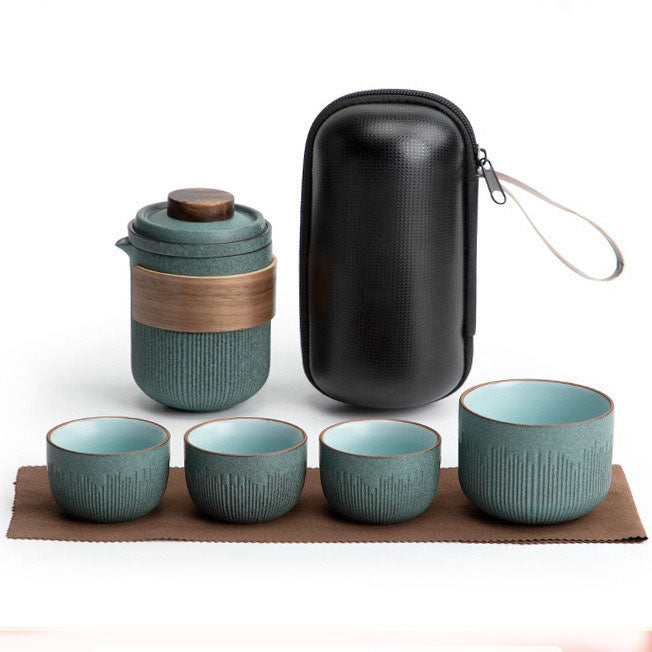 Top-down view of the portable ceramic tea set arranged inside its travel bag, showcasing compact storage.