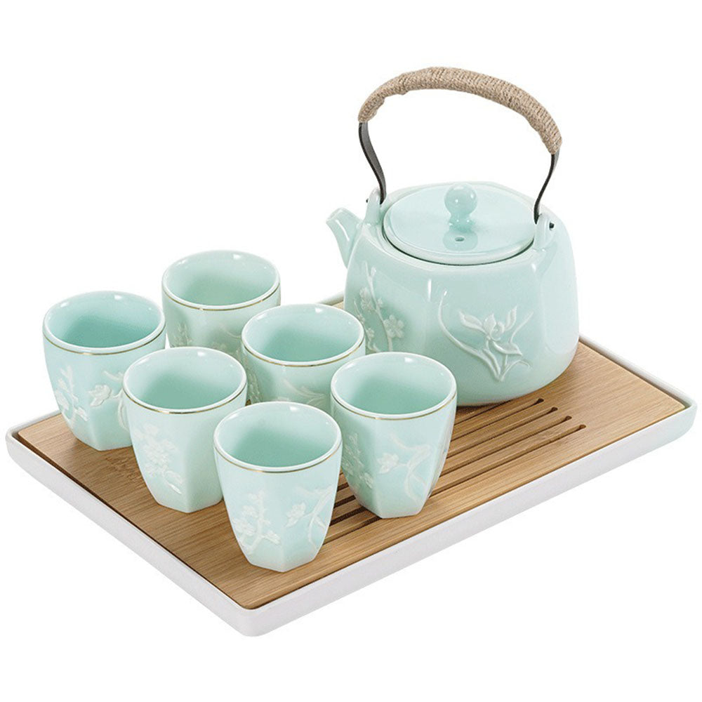 Elegant bamboo chrysanthemum tea set displayed on a wooden table.