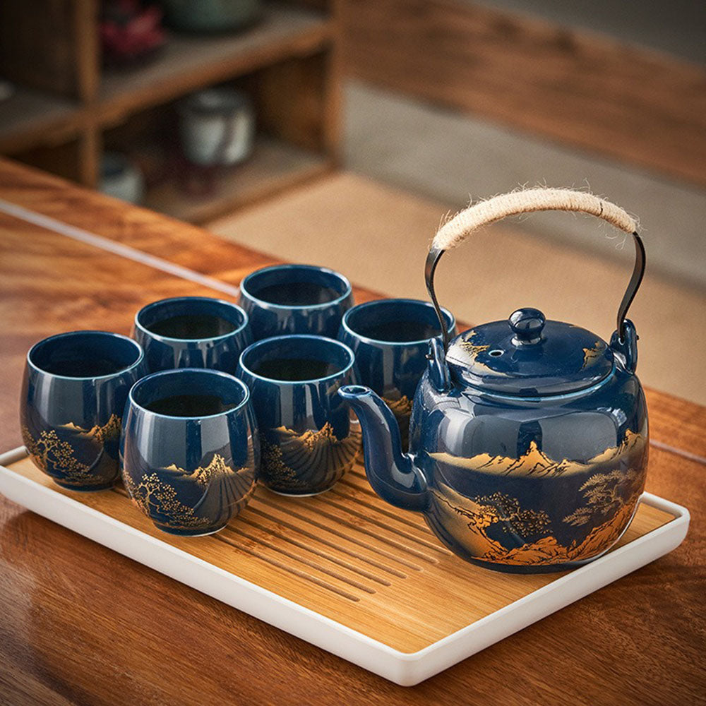 Japanese blue landscape tea set with tray on a wooden table, perfect for gongfu tea ceremony