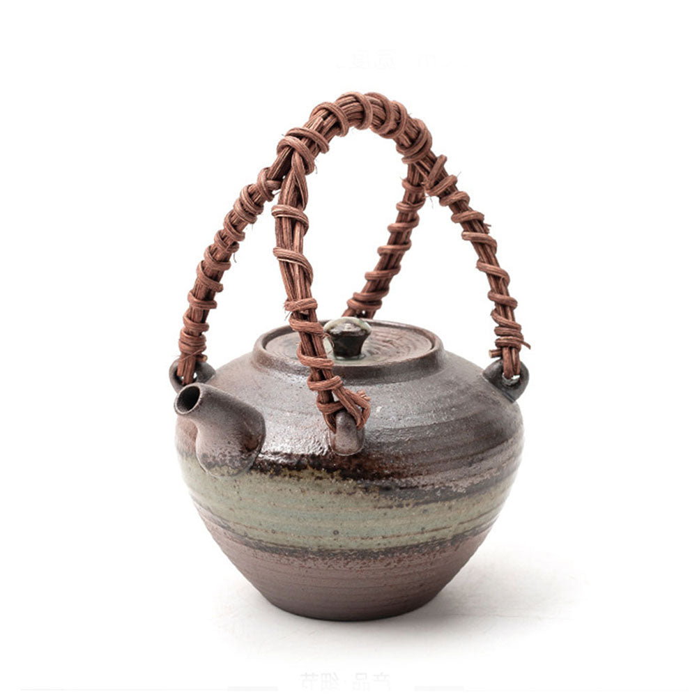 Elegant Japanese bamboo handle teapot from a side angle, showcasing its unique design.
