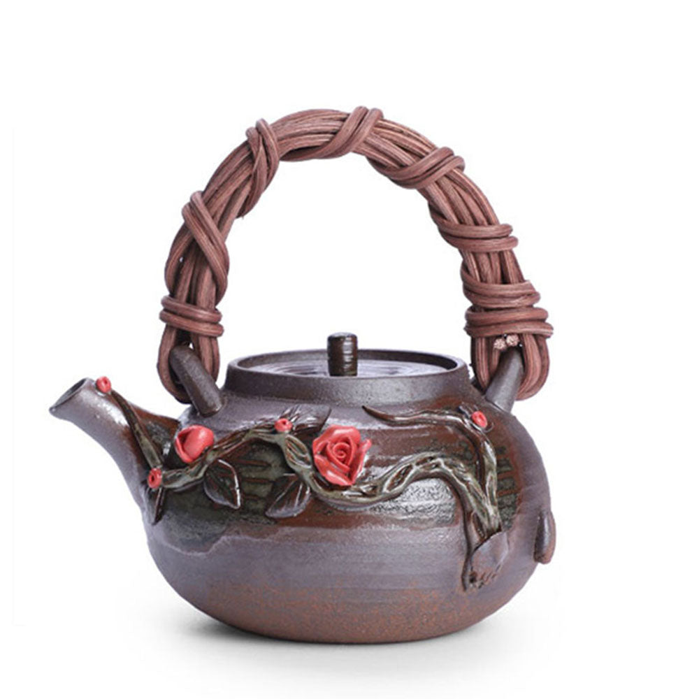 Close-up of the Elegant Japanese Rattan Weaving Teapot highlighting its intricate floral patterns and rattan handle.