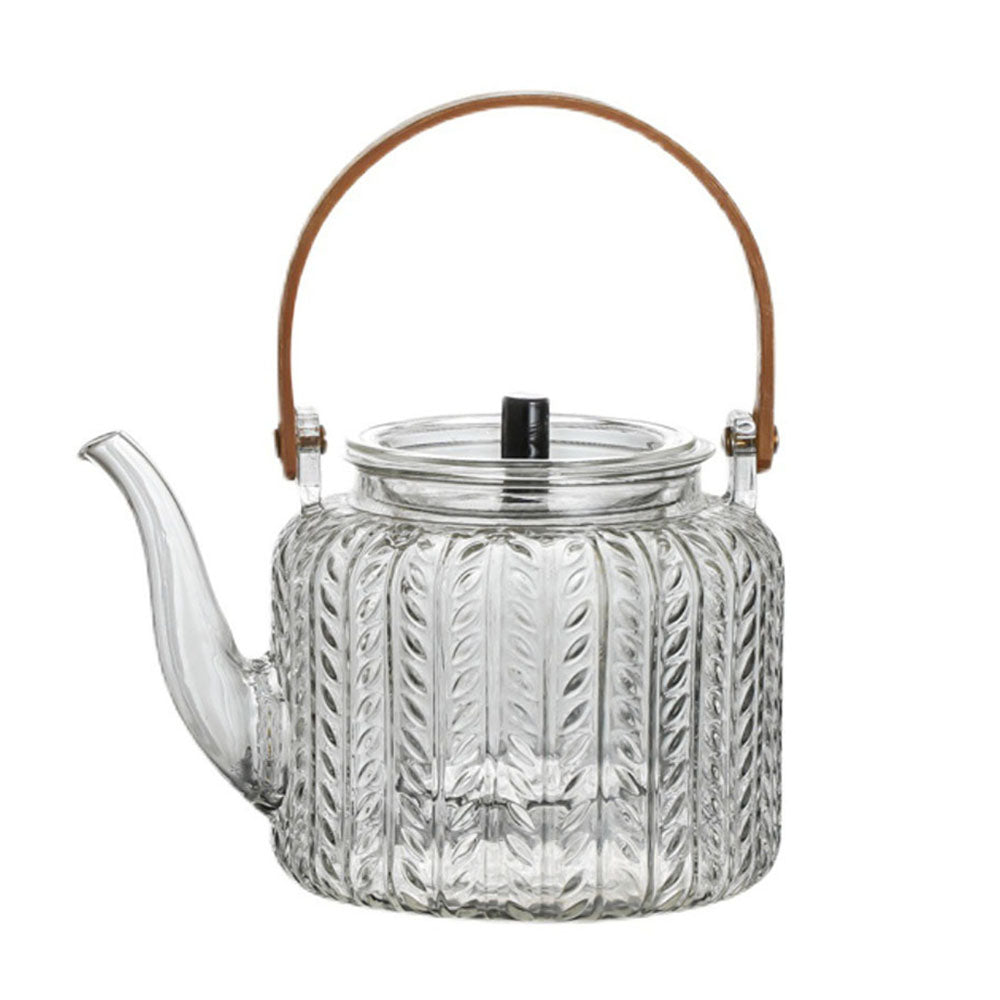 Elegant Japanese glass teapot showcasing the infusion of loose leaf tea.