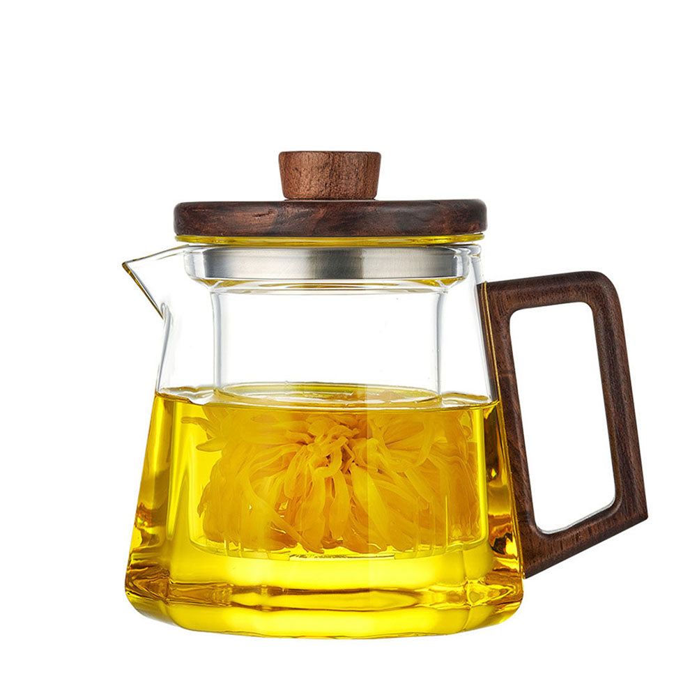 Elegant borosilicate glass teapot from an angle showcasing the wooden handle